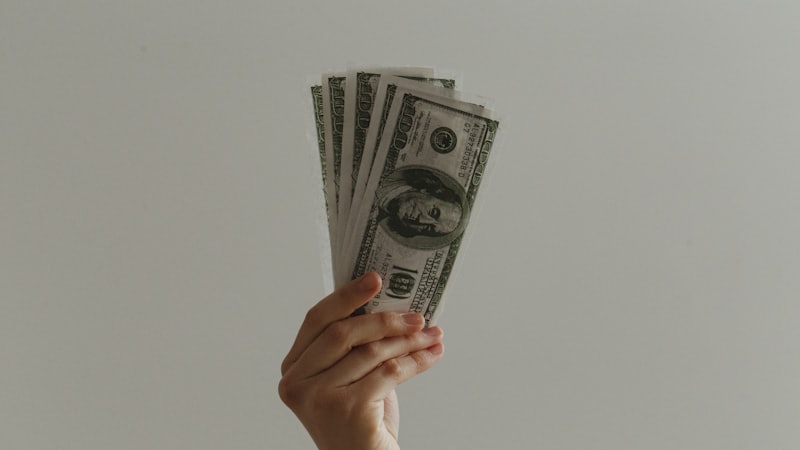 Stacks of cash, representing fixed deposits versus debt mutual funds