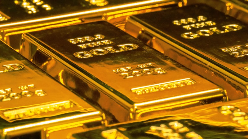 Stacked gold bars, representing gold as an investment option