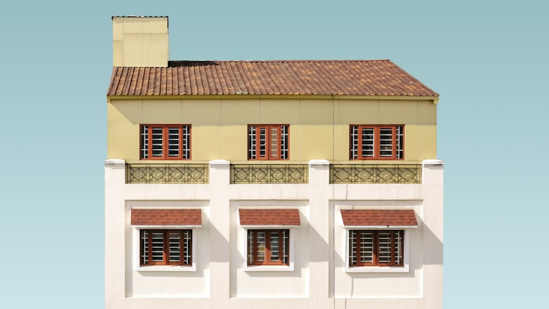 A model house with keys, representing a home loan and its EMI